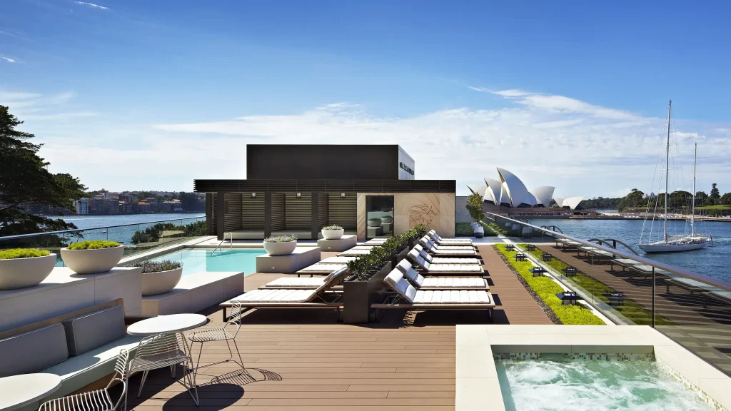 The rooftop pool at Park Hyatt Sydney with stunning views of the Opera House, a luxury hotel for accessible travel in Sydney.