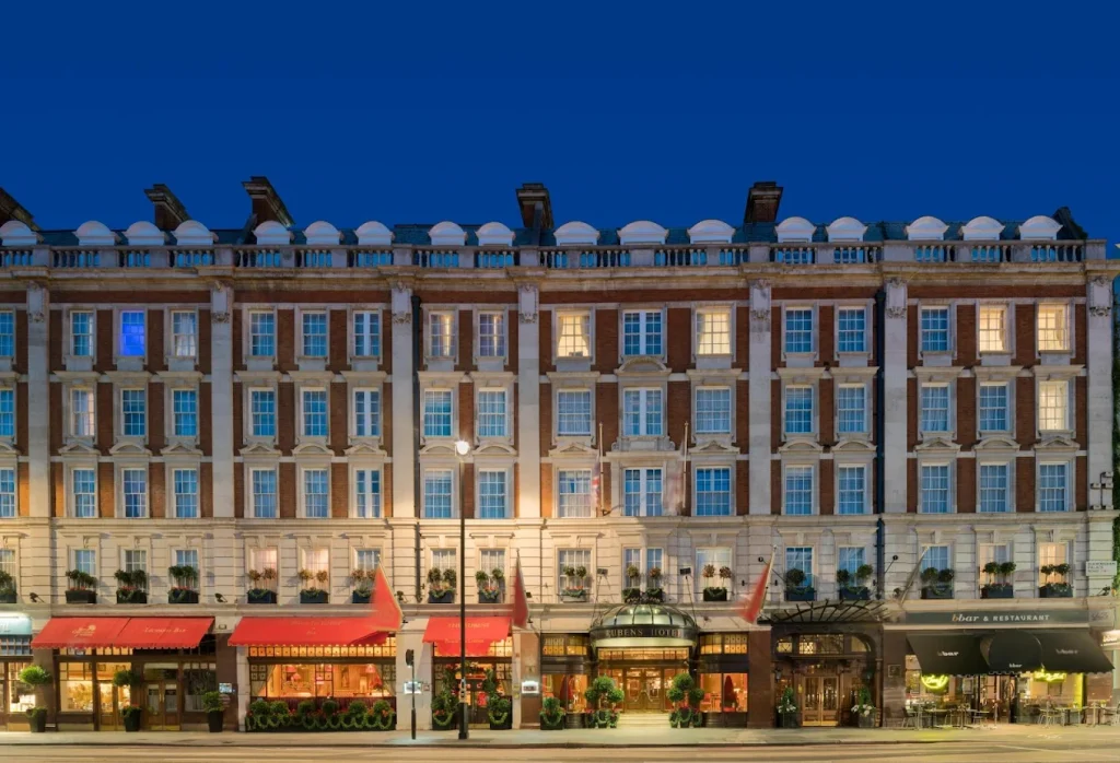 The exterior of The Rubens at the Palace hotel at dusk, a luxury accessible hotel for accessible travel in London.