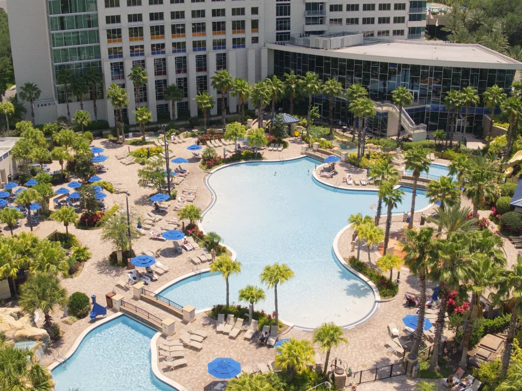 Aerial view of the large Grotto Pool at the Hyatt Regency Orlando, a top-rated hotel for accessible travel in Orlando.