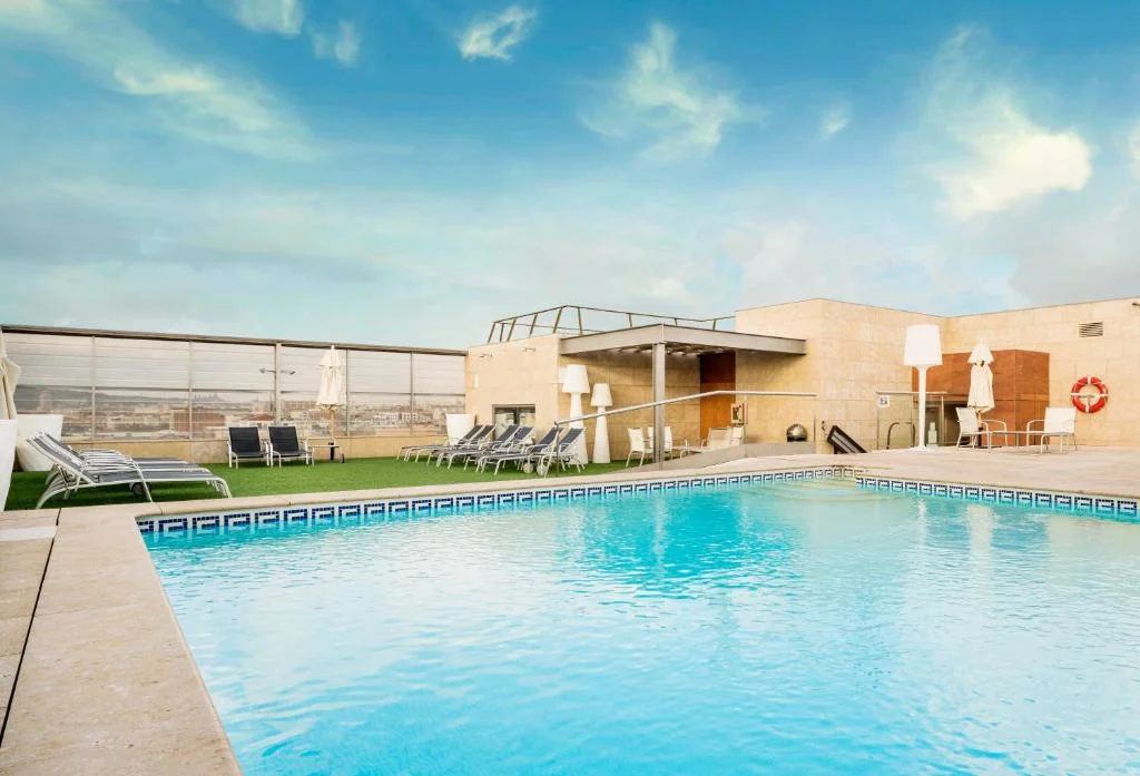 The accessible rooftop pool at Ilunion Barcelona, featuring a pool lift to enhance accessible travel in Barcelona.